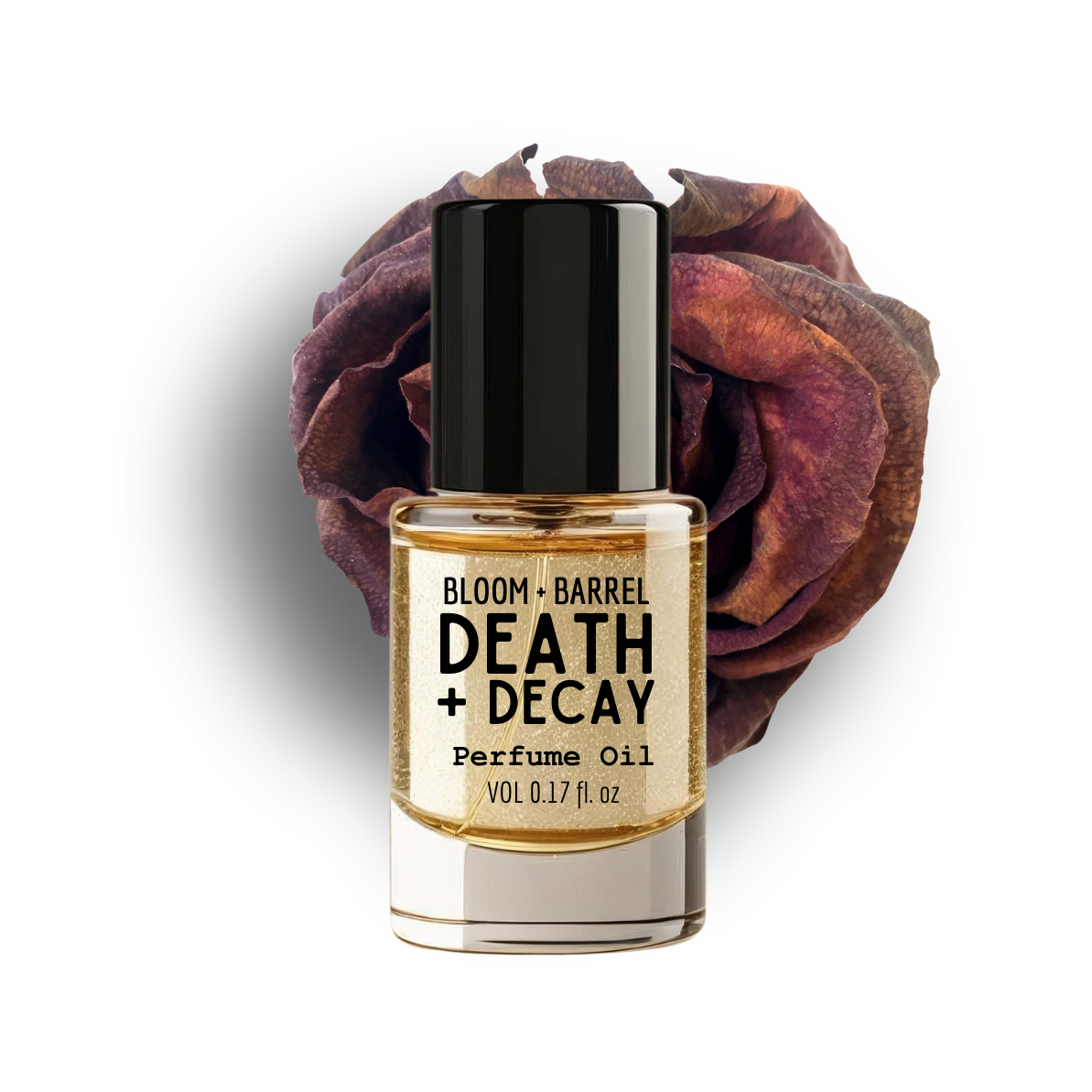 Perfume oil bottle labeled 'Death + Decay' with a dried rose on a white background