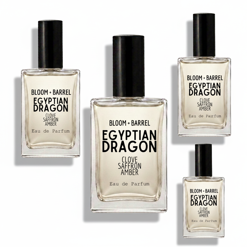 Four glass perfume bottles with black caps arranged on a white background, including the Bloom + Barrel Karma Inspired by Lush Eau de Parfum in different sizes.