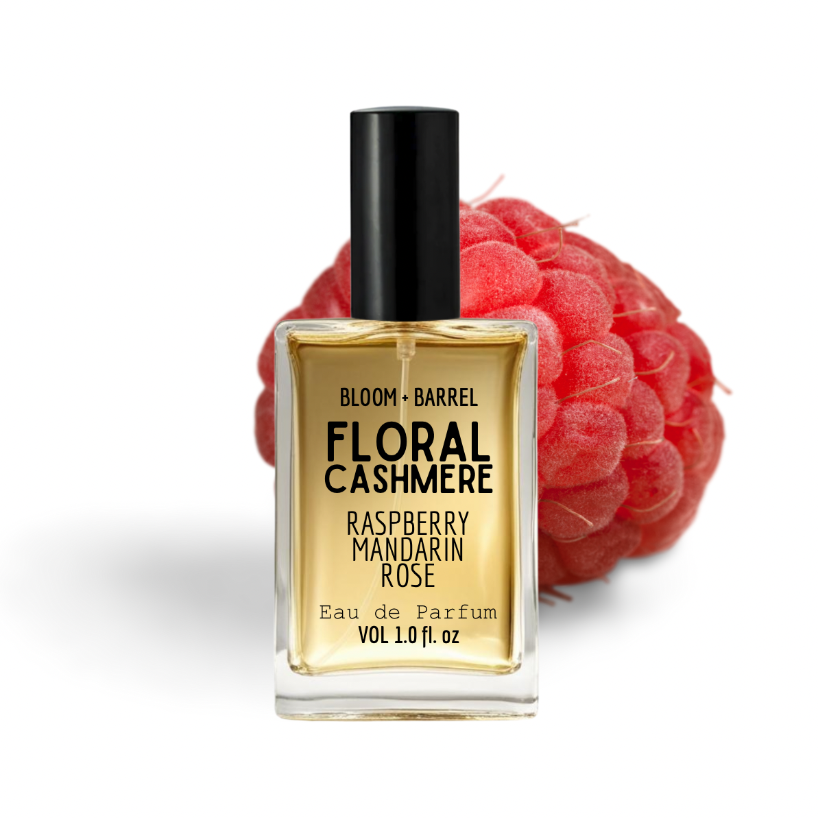 Perfume bottle labeled 'Floral Cashmere' with a raspberry in the background