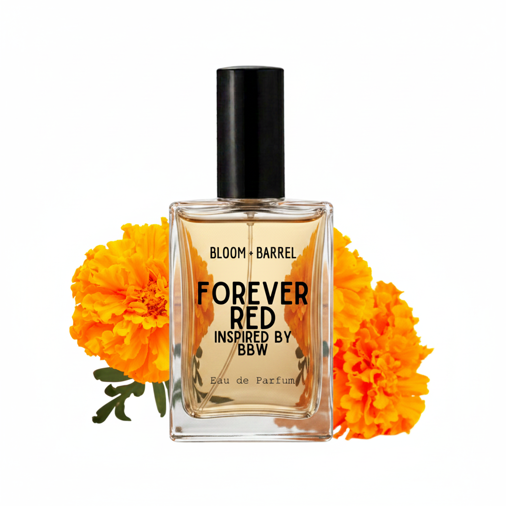 A rectangular glass perfume bottle with a black cap, labeled 'FOREVER RED INSPIRED BY BBW' and 'BLOOM • BARREL', centered on a white background with bright orange marigold flowers behind it.