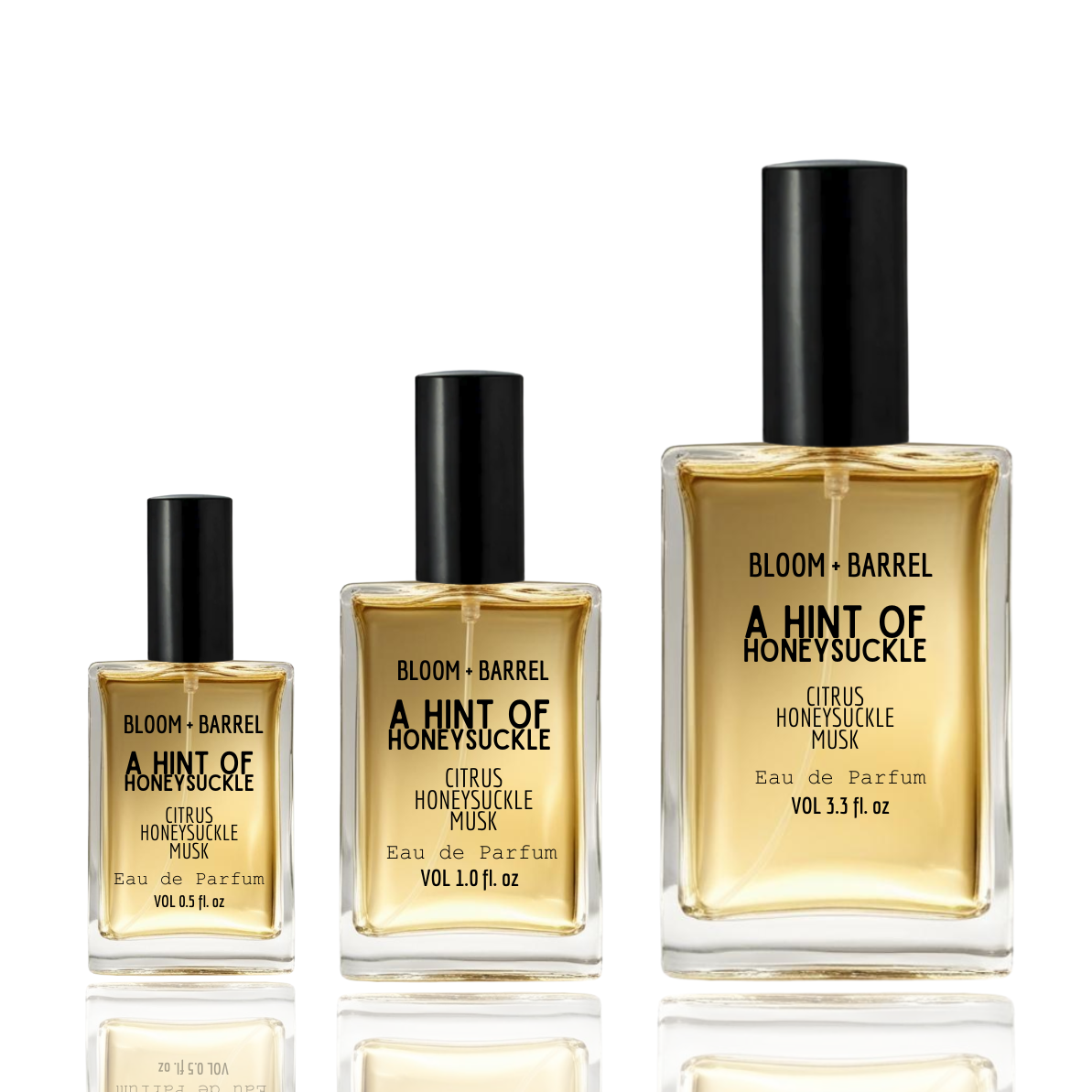 Three bottles of 'Bloom & Barrel A Hint of Honeysuckle' perfume on a white background