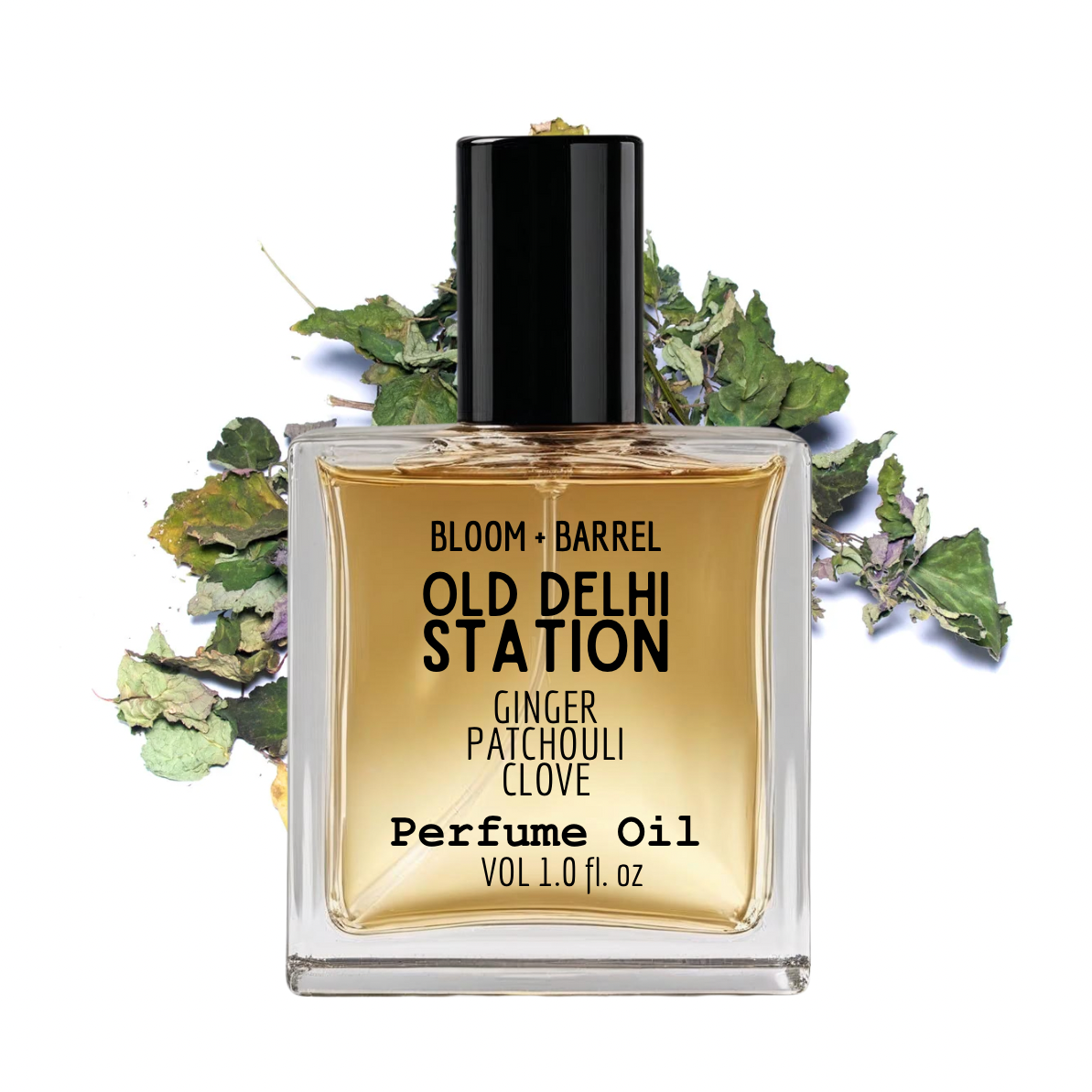 Perfume oil bottle labeled 'Old Delhi Station' with decorative leaves on a white background