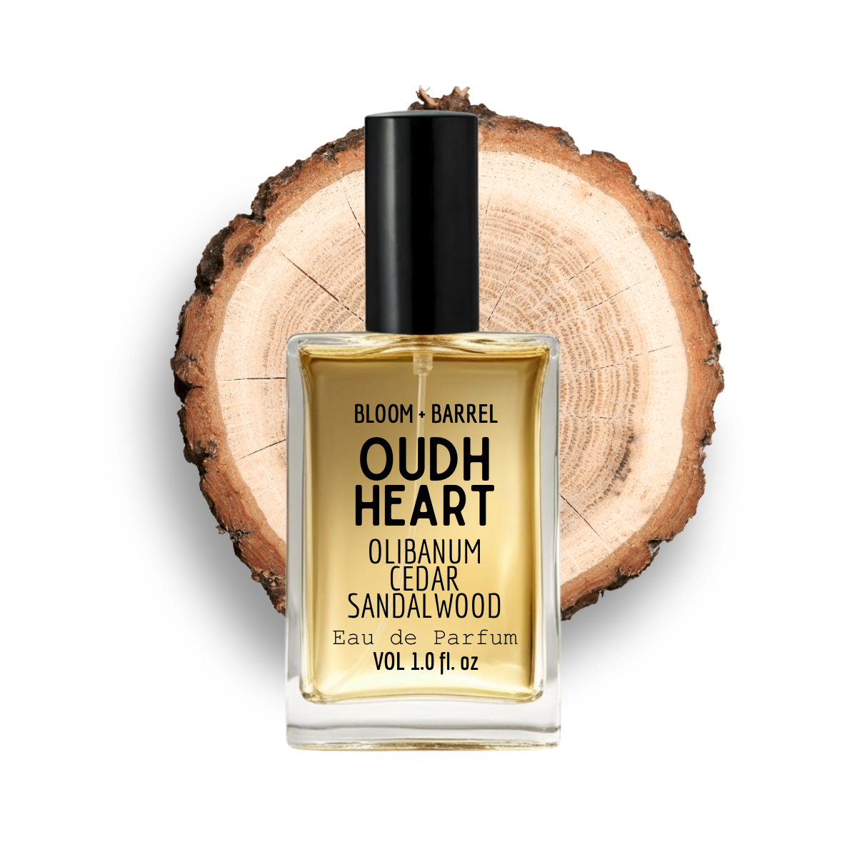 Perfume bottle labeled 'Oudh Heart' on a wooden background