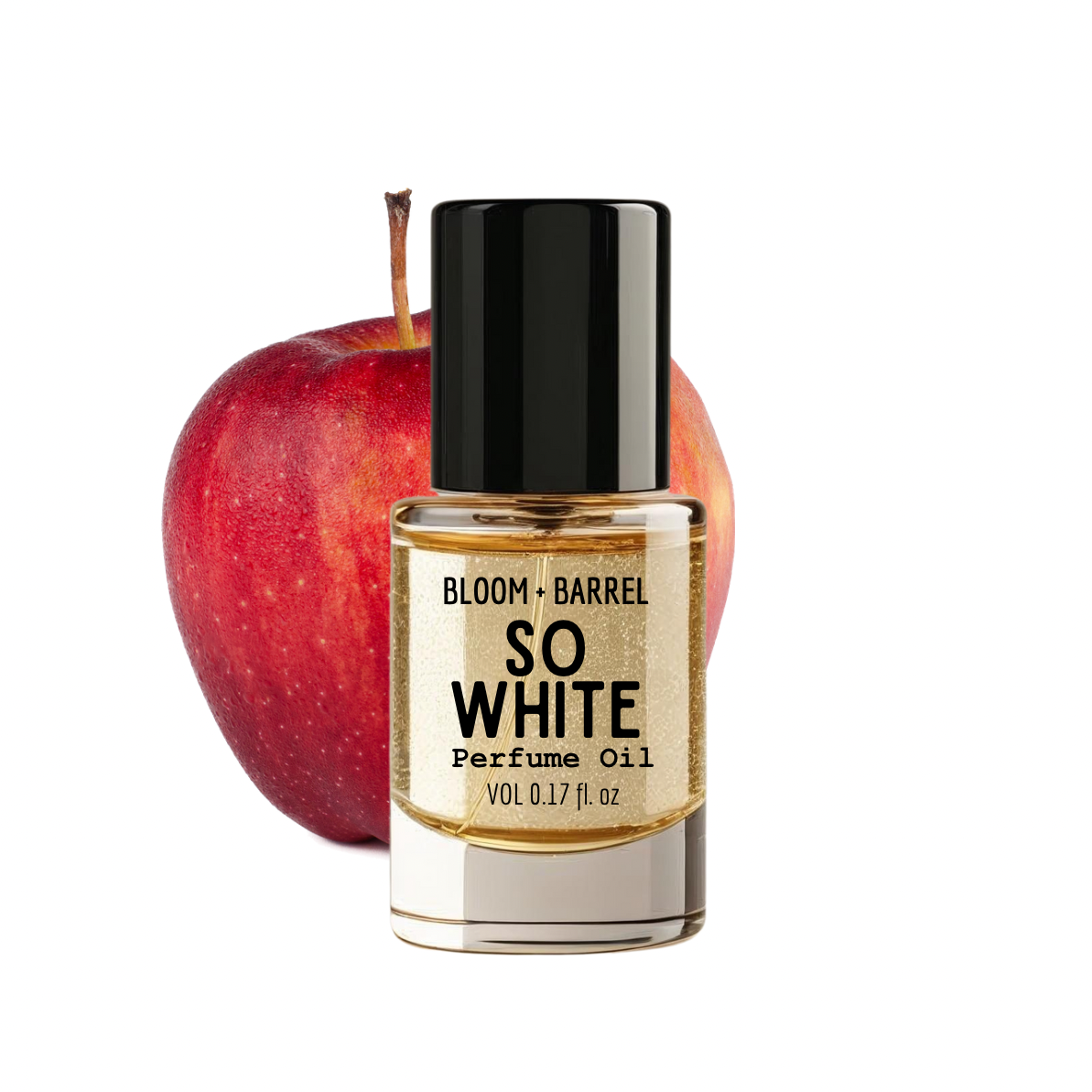 Bottle of Bloom & Barrel So White perfume oil with an apple on a white background