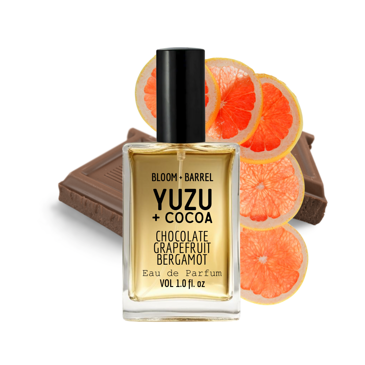 Perfume bottle labeled 'Yuzu + Cocoa' with chocolate and grapefruit slices on a white background
