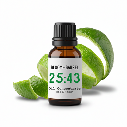 Bottle of Bloom & Barrel oil concentrate with green leaves on a white background
