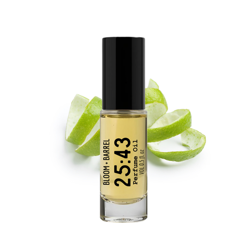 Perfume bottle labeled 'Bloom & Barrel 25:43' with green apple slices on a white background