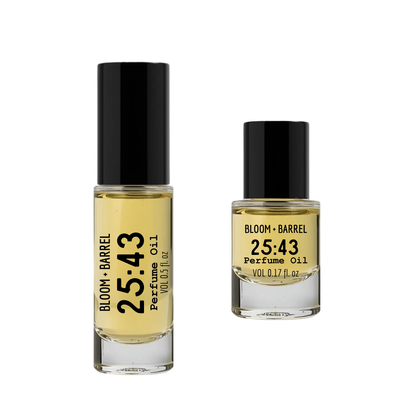 Two bottles of Bloom & Barrel 25:43 perfume oil on a white background