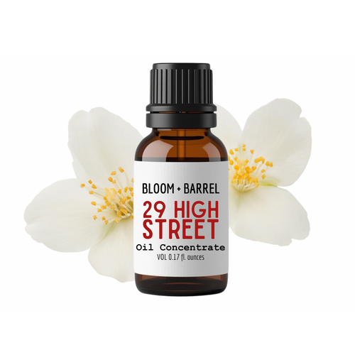 Bottle of '29 High Street' oil concentrate with flowers on a white background