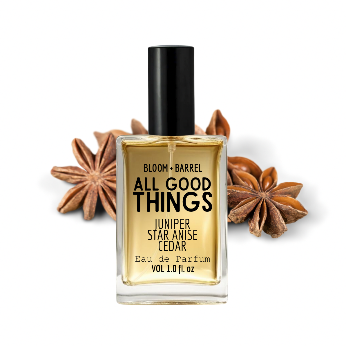 Perfume bottle labeled 'All Good Things' with star anise and juniper berries on a white background