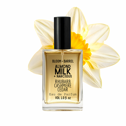 Perfume bottle labeled 'Bloom + Barrel' with a yellow flower on a white background