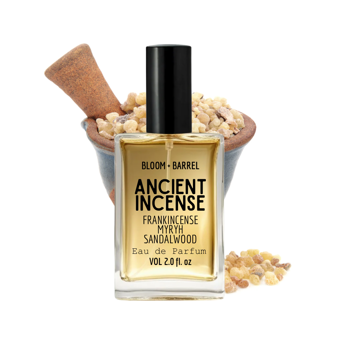 A bottle of Bloom + Barrel Ancient Incense Eau de Parfum, featuring a clear glass bottle with a black cap and golden-amber liquid, set against a white background with a wooden mortar and pestle filled with dried spices.