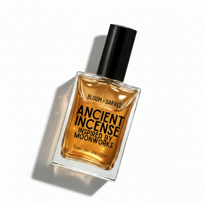 A rectangular glass bottle of Bloom Barrel Ancient Incense Eau de Parfum with amber-colored liquid and a black cap, centered on a plain white background.