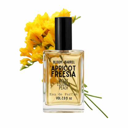 Perfume bottle labeled 'Apricot Freesia' with yellow flowers on a white background