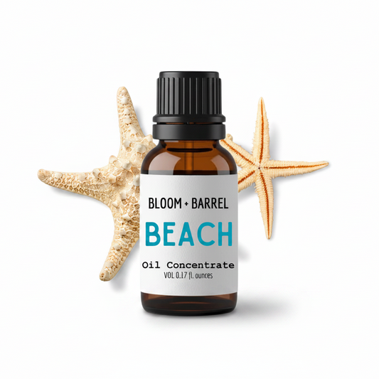 Bottle of Bloom & Barrel Beach Oil Concentrate with starfish on a white background