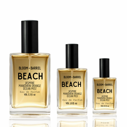 Three bottles of Bloom & Barrel Beach perfume on a white background