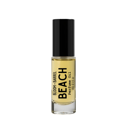 Perfume bottle labeled 'Beach' by Bloom & Barrel on a white background