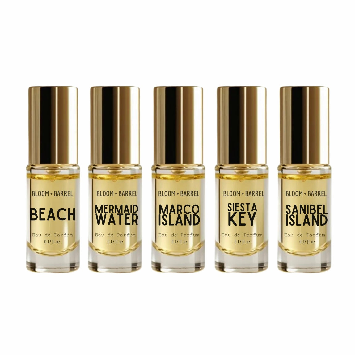 Five small bottles of Bloom & Barrel perfume with gold caps on a white background