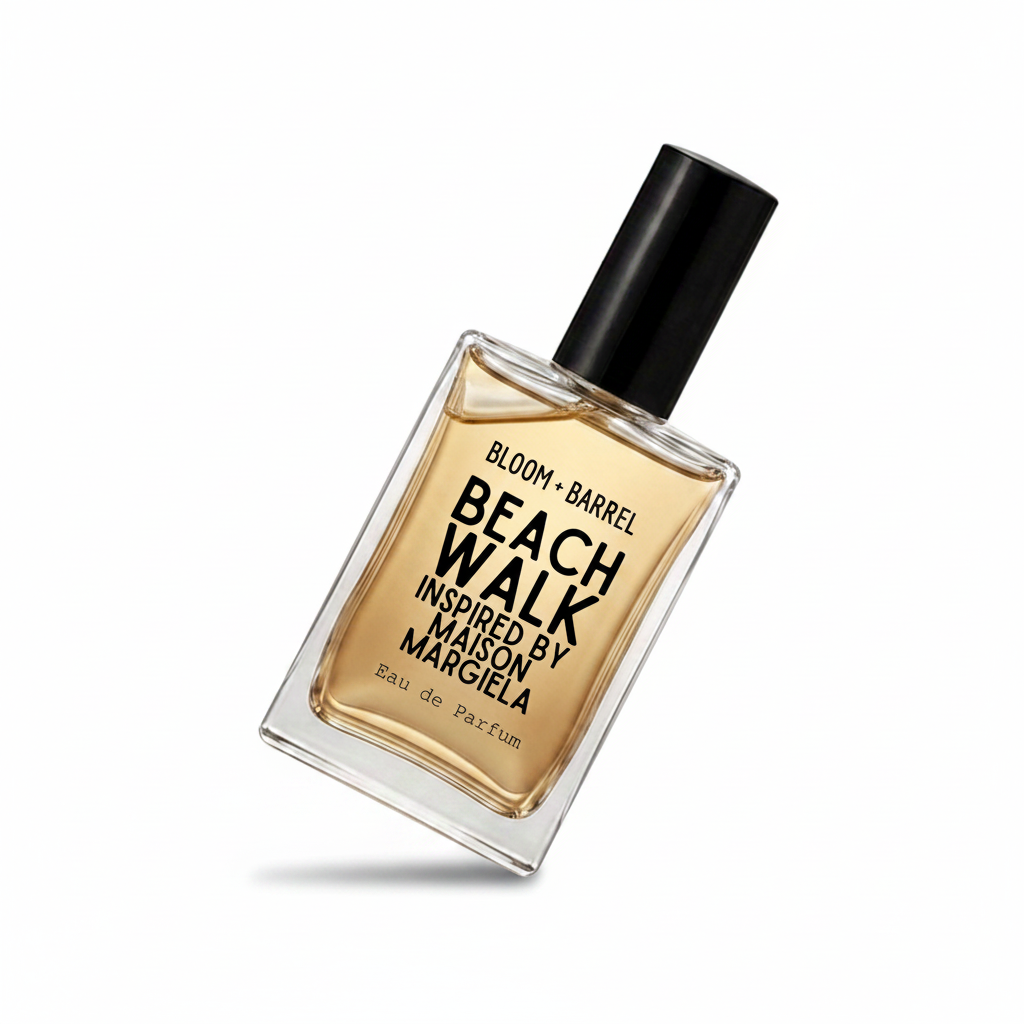 A bottle of Maison Margiela Beach Walk Eau de Parfum with amber-colored liquid in a clear glass bottle, a black cap, and black text on the front, set against a plain white background.