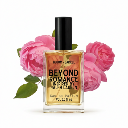 A bottle of Ralph Lauren Beyond Romance Eau de Parfum, featuring a clear glass bottle with golden-amber liquid, a black cap, and pink roses in the background on a white backdrop.