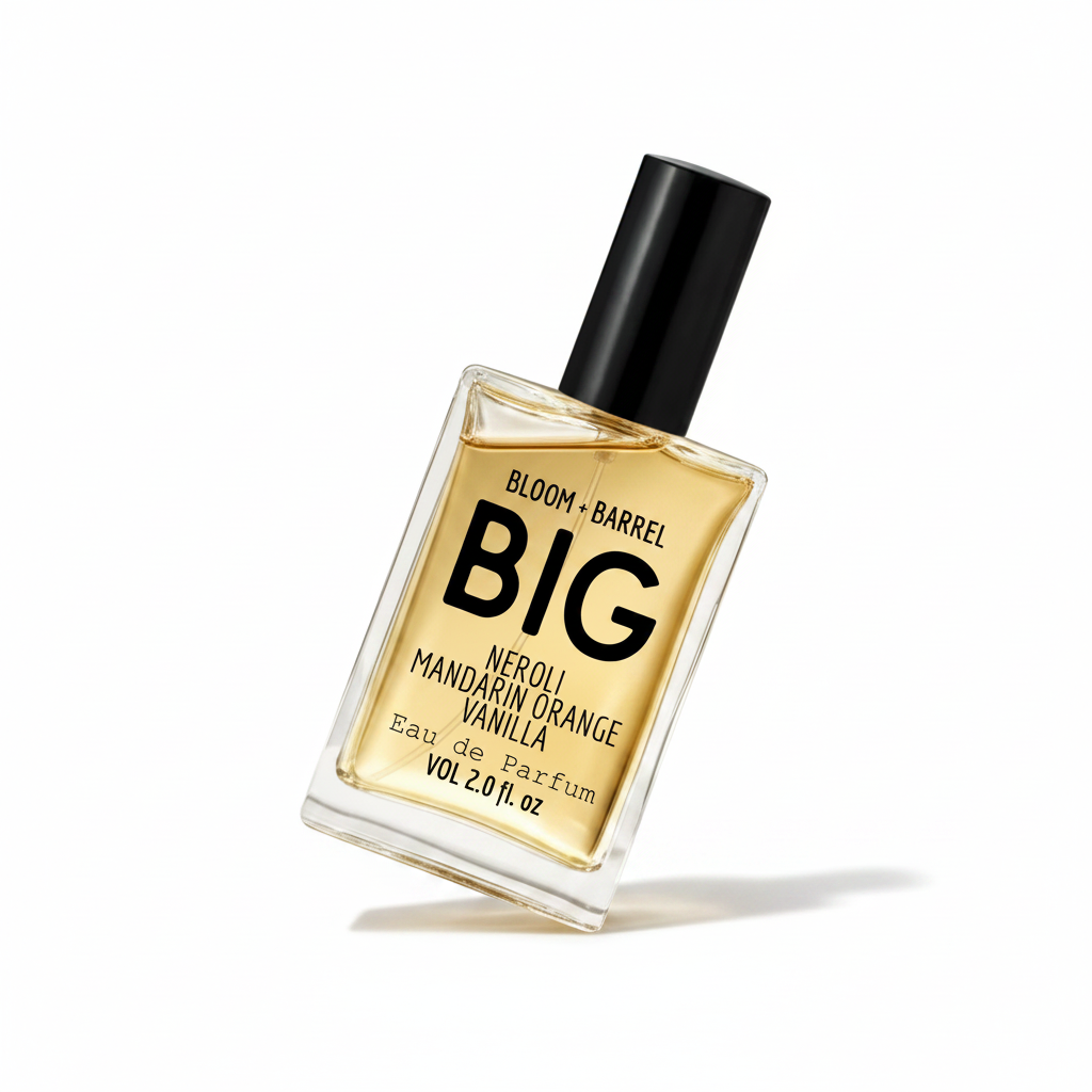 A rectangular glass bottle of Bloom + Barrel big Eau de Parfum with a black cap, filled with golden-amber liquid, on a plain white background.