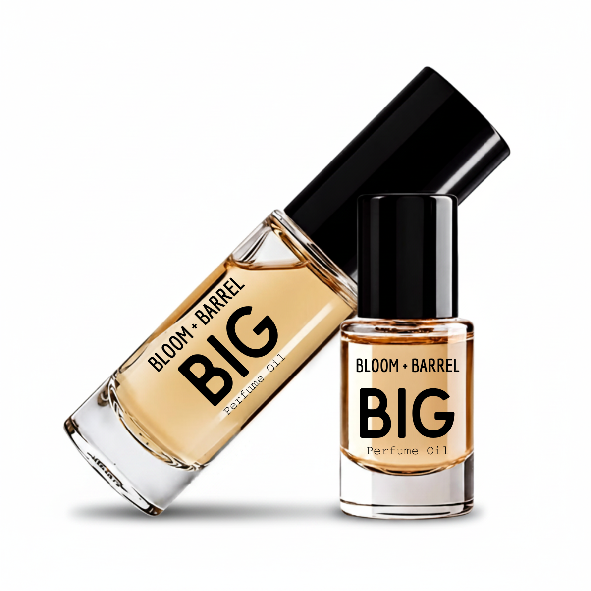 Two glass bottles of BLOOM + BARREL Dragons Blood Perfume Oil with black caps, one larger bottle lying diagonally and one smaller bottle standing upright, on a white background.