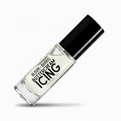 A clear glass perfume bottle with a black cap, labeled 'BLOOM + BARREL BUTTERCREAM ICING Perfume Oil', shown on a clean white background with a soft shadow.