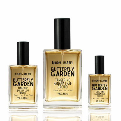 Three bottles of Bloom & Barrel Strawberry Soda perfume on a white background