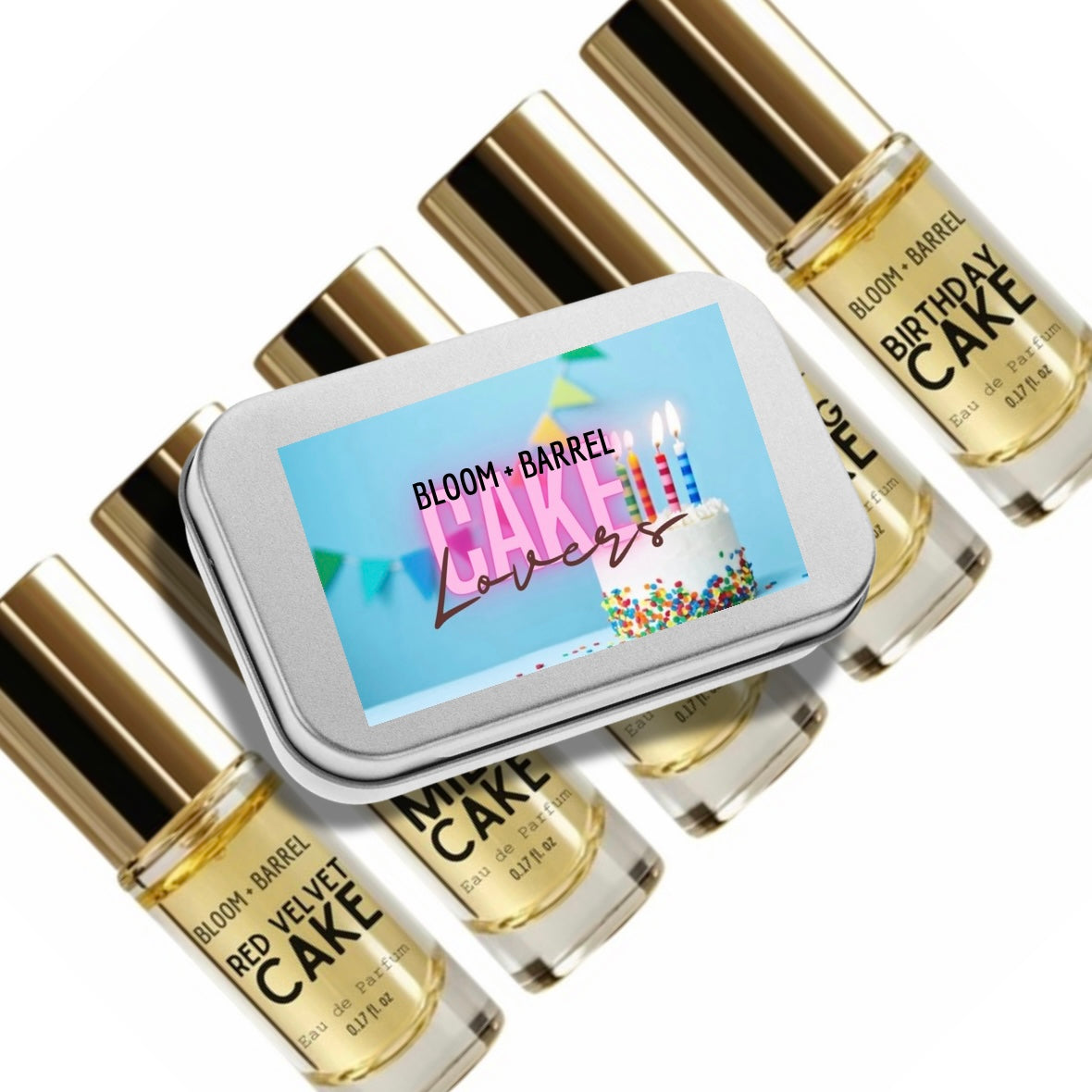 Six small perfume bottles labeled BLOOM+BARREL with different scents (Straw Berries, Blue Berries, Peachy Apricot, Princess Banana, Watermelon) lined up on a white platform against a light green background with fruit illustrations.