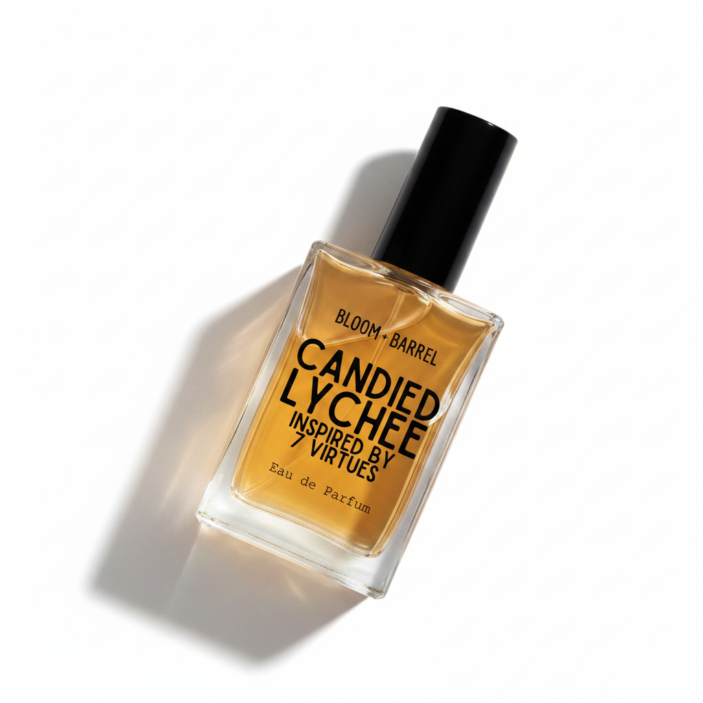 A rectangular glass bottle of Candied Lychee Eau de Parfum with amber-colored liquid, a black cap, and black text on the front, centered on a plain white background.