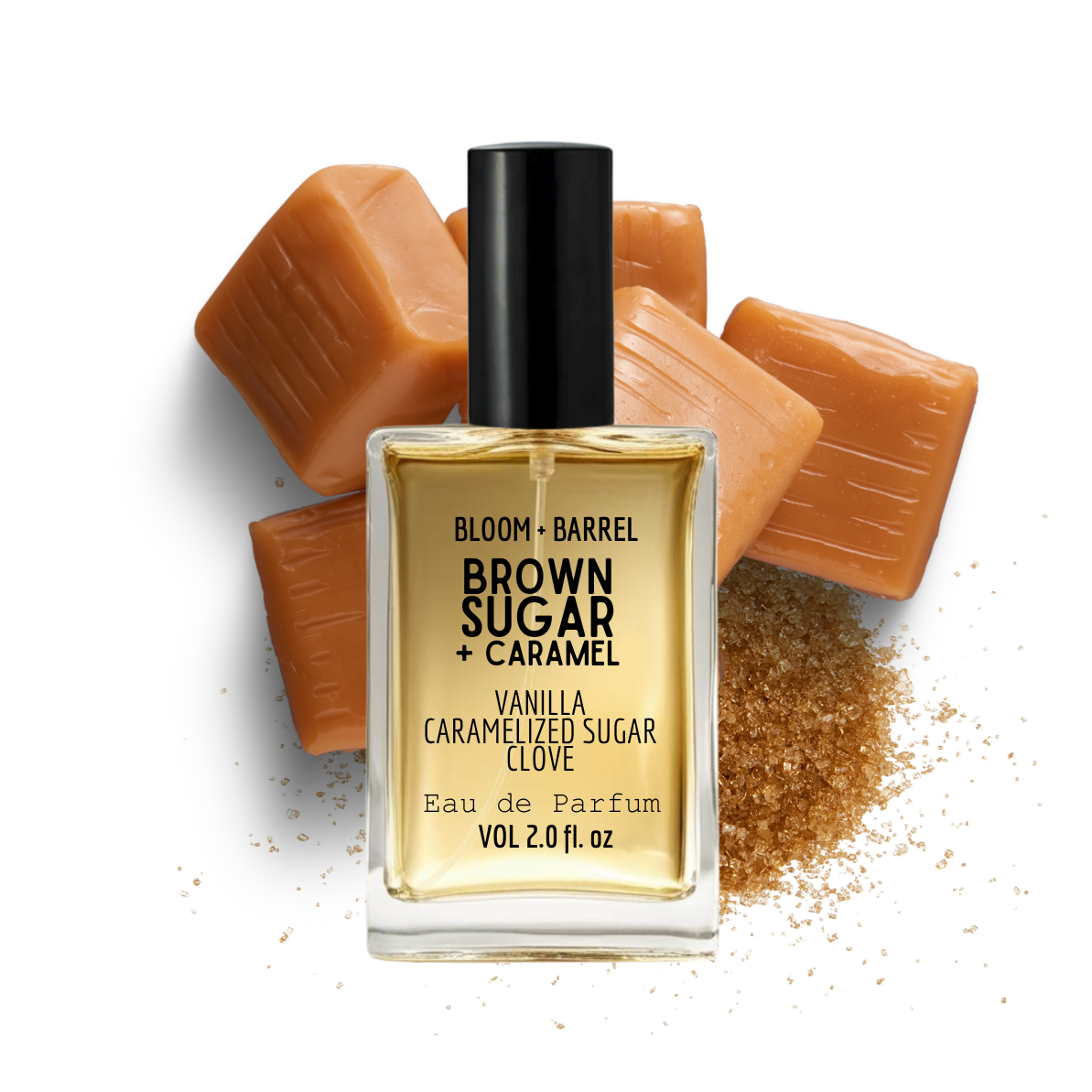 Perfume bottle labeled 'Brown Sugar + Caramel' with brown sugar crystals and a scoop of brown sugar on a white background.