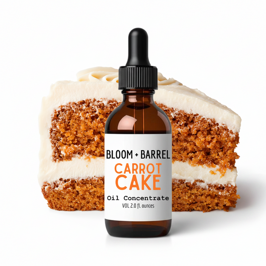 Bottle of Bloom + Barrel Carrot Cake oil concentrate with a slice of carrot cake in the background.