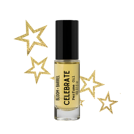 Perfume bottle labeled 'Bloom & Barrel Celebrate' with decorative gold stars on a white background