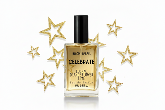 Perfume bottle labeled 'Celebrate' with gold label and black cap on a white background with gold stars.