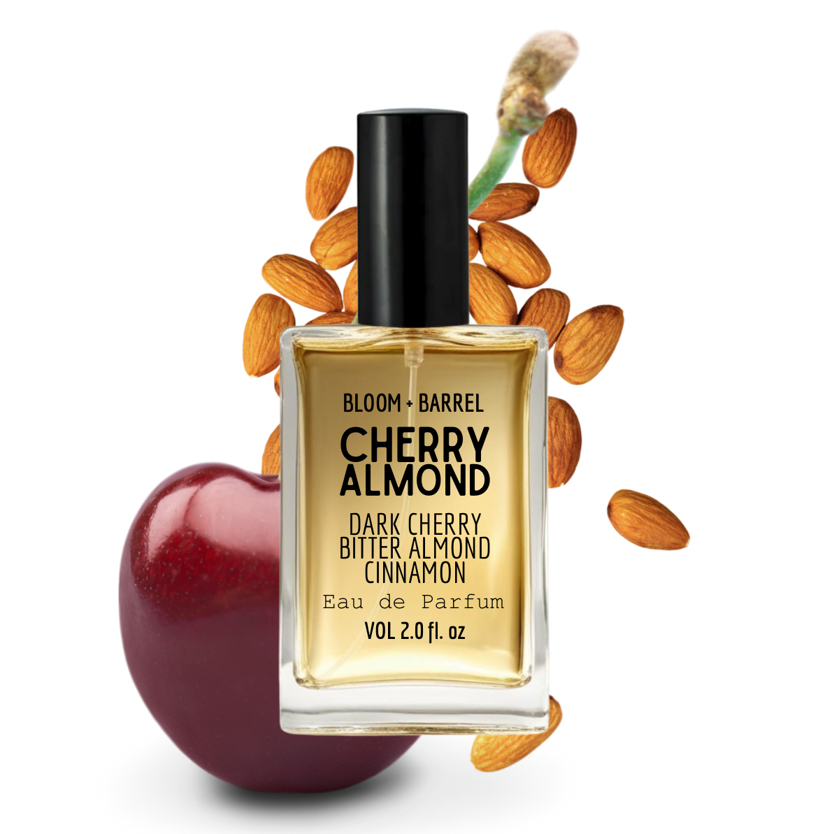 Perfume bottle labeled 'Cherry Almond' with almonds and an apple on a white background