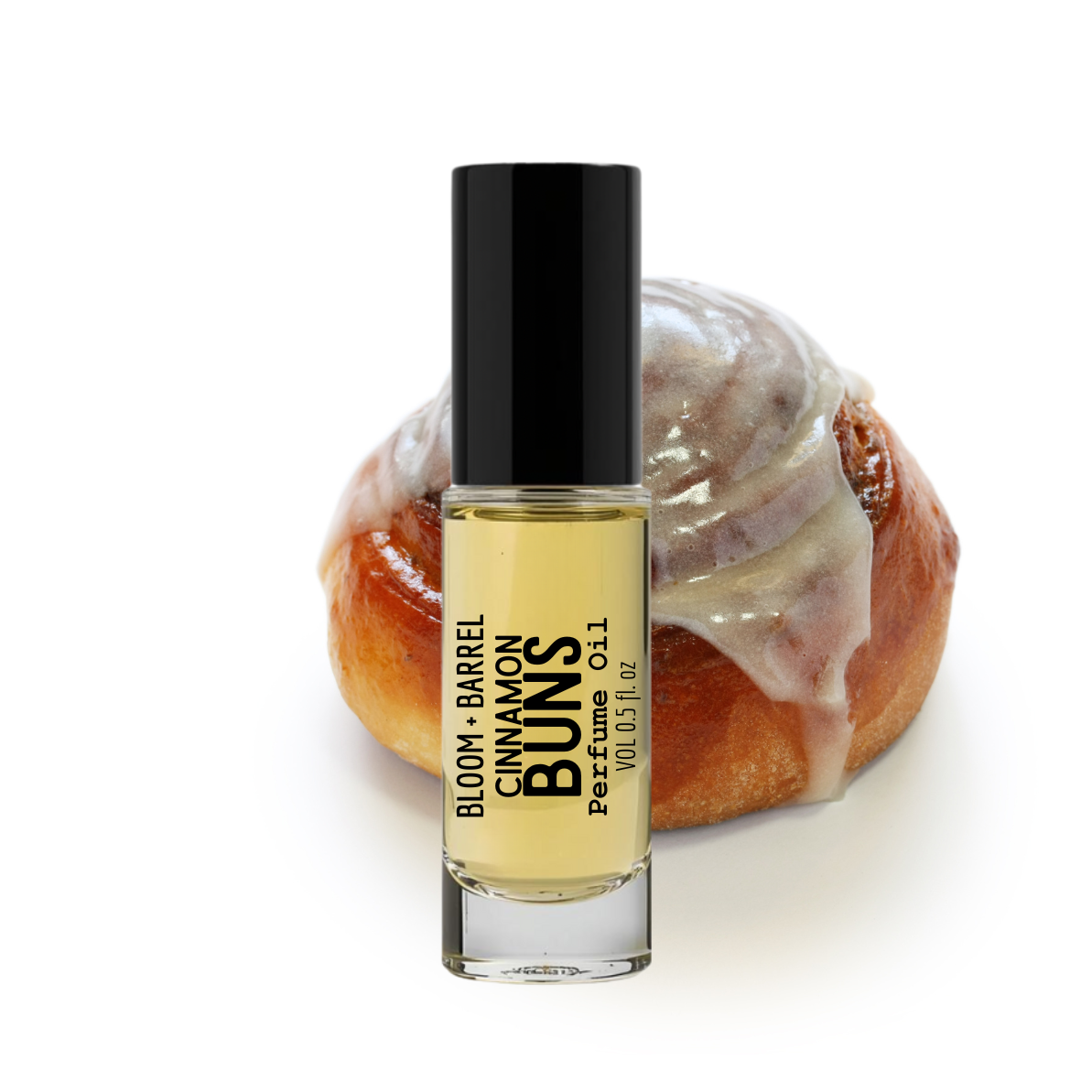 Perfume bottle labeled 'Bloom & Barrel Cinnamon Buns' with a cinnamon roll in the background
