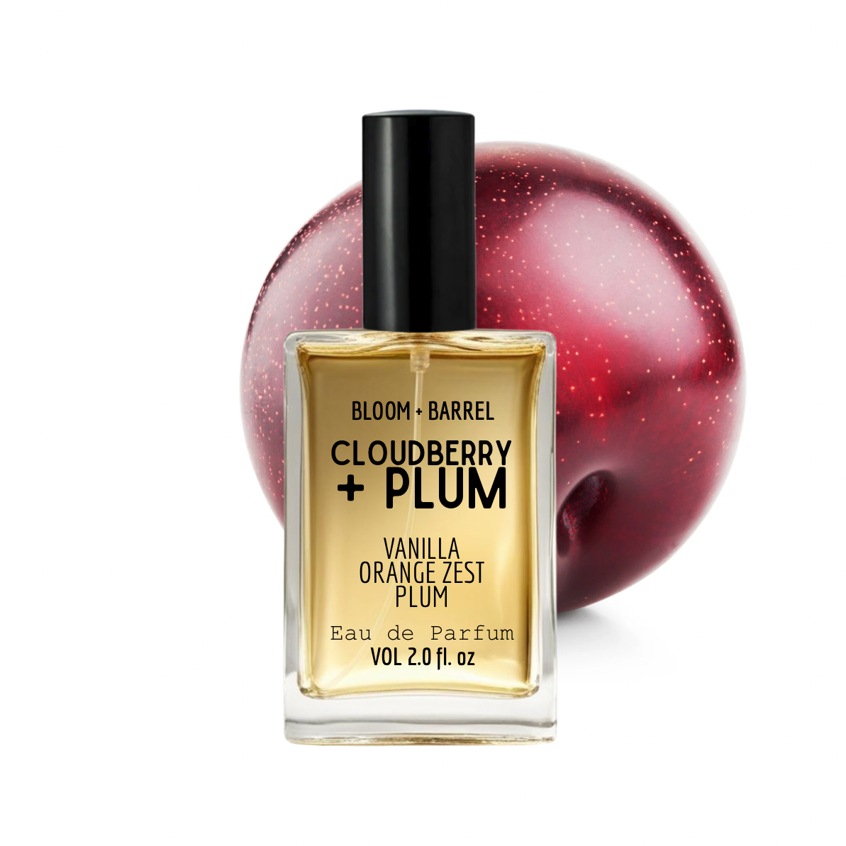 Perfume bottle labeled 'Cloudberry + Plum' with a plum in the background