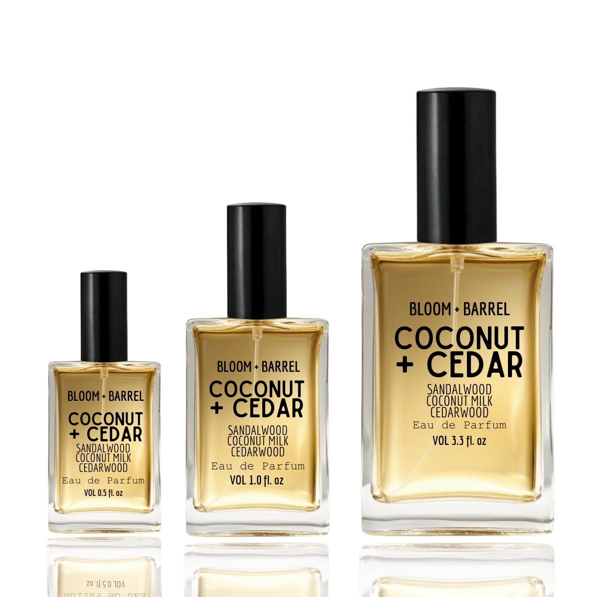 Three bottles of Bloom + Barrel Coconut + Cedar perfume on a white background