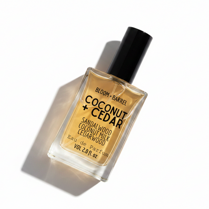 Bottle of Bloom + Barrel Coconut + Cedar sandalwood coconut milk cedarwood eau de parfum on a white background