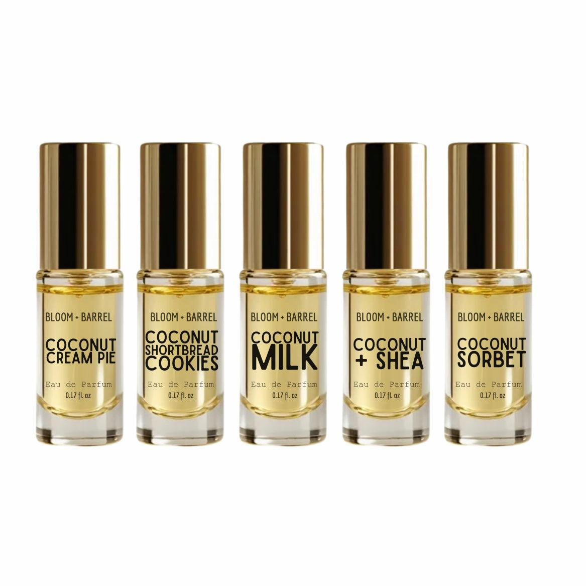 Five small clear glass bottles with metallic gold caps and gold-toned liquid, arranged in a row on a white background. The labels read Bloom + Barrel and various coconut-flavored variants including Cream Pie, Shortbread Cookies, Milk, + Shea, and Sorbet.