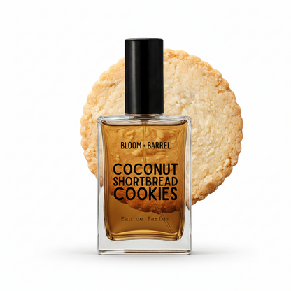 A perfume bottle labeled 'BLOOM • BARREL' and 'COCONUT SHORTBREAD COOKIES' stands in front of a round cookie graphic on a white background.