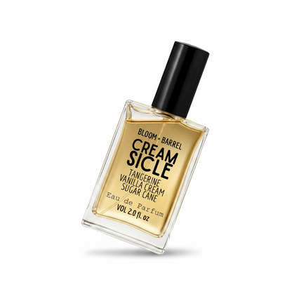 Perfume bottle labeled 'Cream Sicle' by Bloom & Barrel on a white background