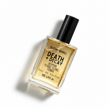 Perfume bottle labeled 'Death + Decay' by Bloom & Barrel on a white background