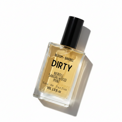 Perfume bottle labeled 'DIRTY' by Bloom & Barrel on a white background