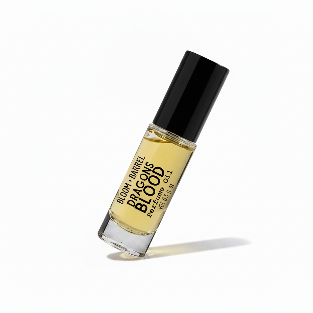Perfume bottle labeled 'Dragon's Blood' by Bloom & Barrel on a white background