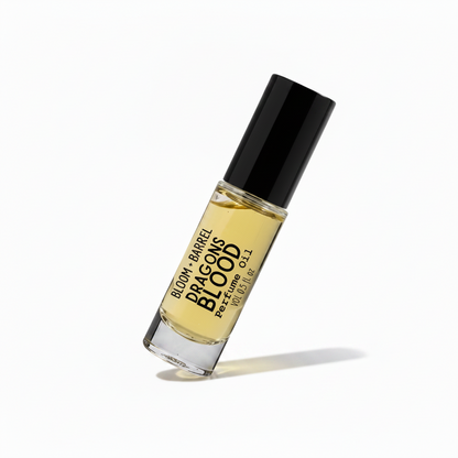Perfume bottle labeled 'Dragon's Blood' by Bloom & Barrel on a white background