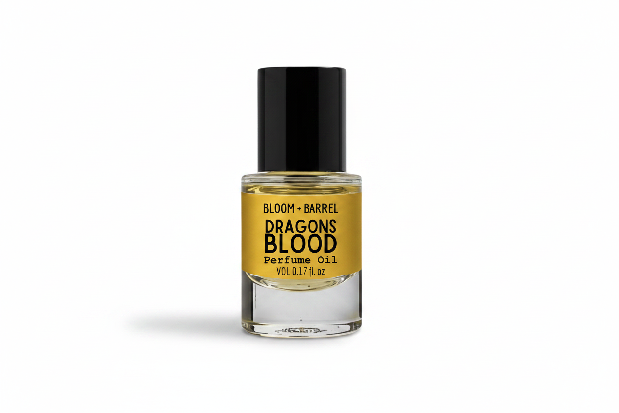 Perfume oil bottle labeled 'Dragons Blood' by Bloom & Barrel on a white background