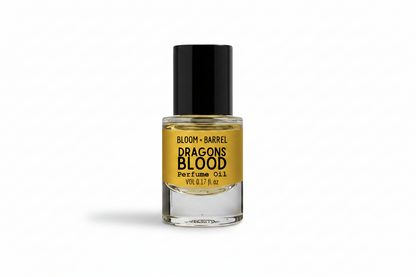 Perfume oil bottle labeled 'Dragons Blood' by Bloom & Barrel on a white background