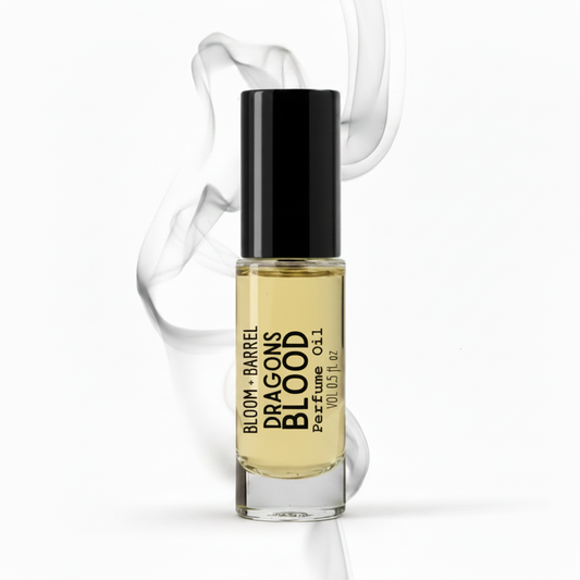 Perfume bottle labeled 'Bloom & Barrel Dragons Blood' with a black cap on a white background