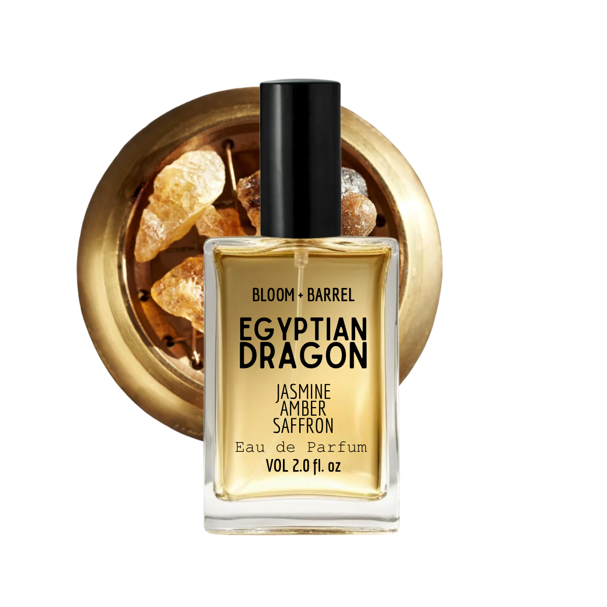 A bottle of Bloom + Barrel Egyptian Dragon Jasmine Amber Saffron Eau de Parfum, featuring a clear glass bottle with golden-yellow liquid, a black cap, and a gold-toned circular background graphic containing amber crystals.